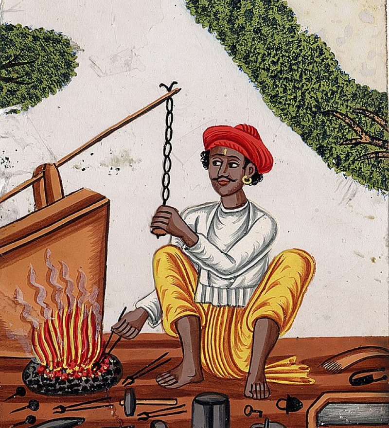 640px-A_blacksmith_in_front_of_his_fire_with_one_hand_on_a_chain_attached_to_the_bellows